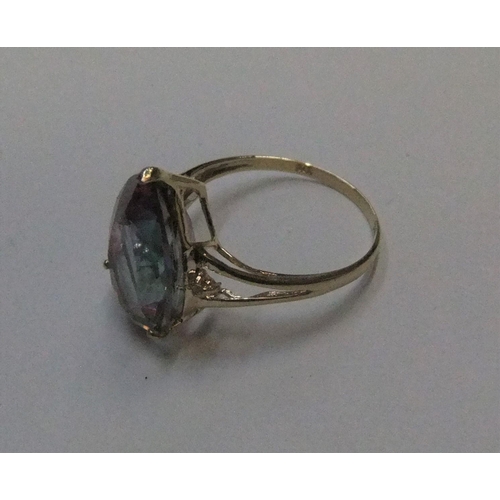 9 - 9ct yellow imported gold ring with large pear cut mystic topaz with a small diamond to either flank
... 