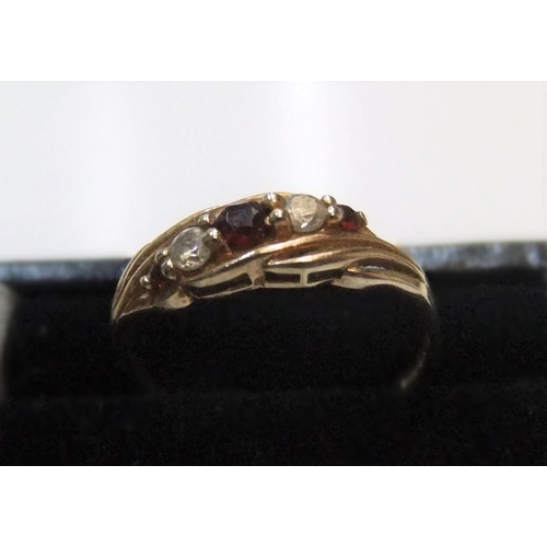 48 - 9ct yellow gold diamond & garnet ring

Approx 1.5 grams gross,             size Q