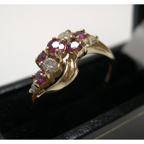 22 - 9ct yellow gold with a modernist ruby & diamond setting

Approx 1.9 grams gross,            size M