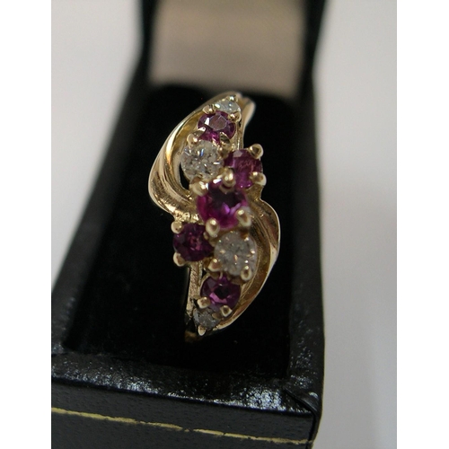 22 - 9ct yellow gold with a modernist ruby & diamond setting

Approx 1.9 grams gross,            size M