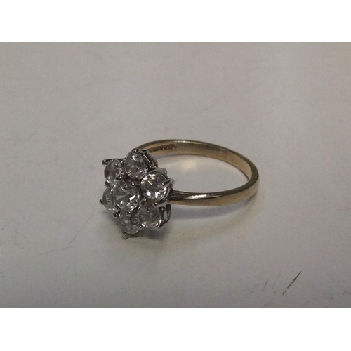 49 - 9ct yellow gold, CZ cluster ring

Approx 2.7 grams gross,            size M