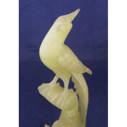 167 - Finely carved jade statue of a bird amongst foliage

26cm high