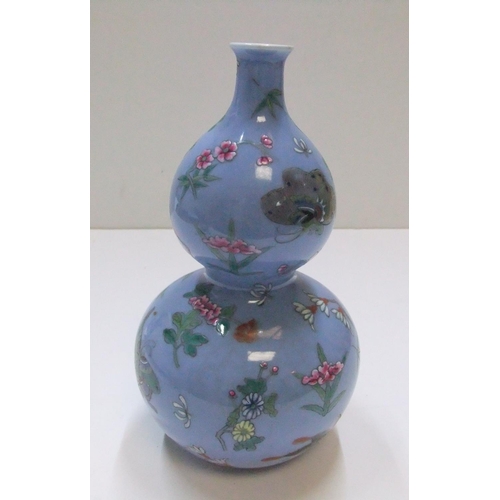 175 - Chinese double gourd blue vase with impressed marks to base

22 cm high