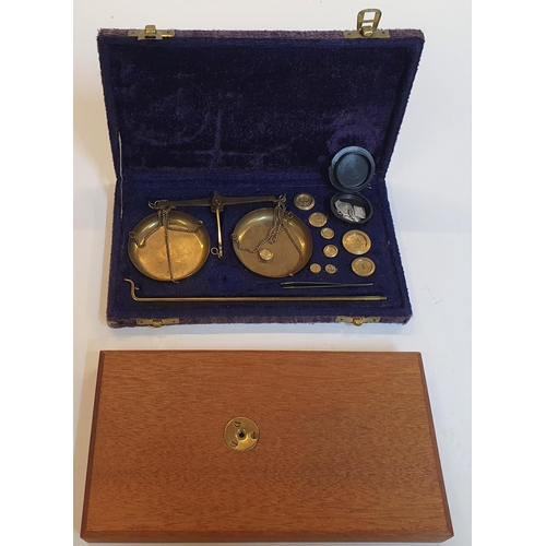 21 - Cased set of Scales and weights complete with wooden screw in base