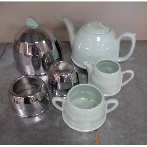28 - Retro mid 20thC tea pot, milk and sugar bowl with removable metal covers (3),

1 handle repaired