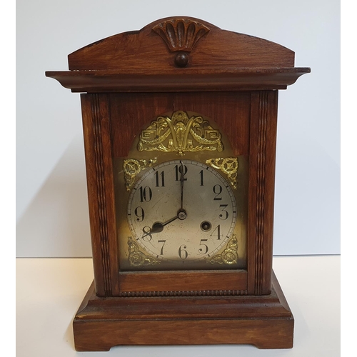 101 - 2 mantle clocks, 1 small gilt metal the other, traditional style wooden, complete with winder key