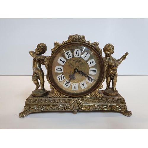 101 - 2 mantle clocks, 1 small gilt metal the other, traditional style wooden, complete with winder key