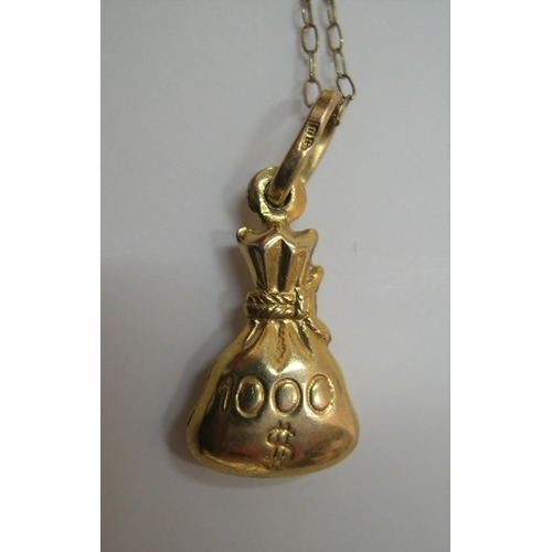 96 - 9ct yellow gold chain & pendant denoting a bag of money

Approx 1.1 grams gross,          16