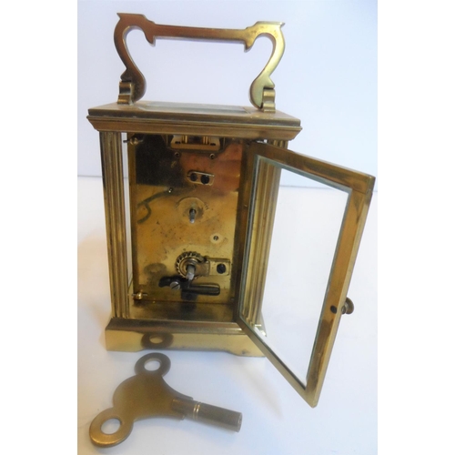 75 - Unmarked 20thC brass cased carriage clock timepiece, with key,

Believed to be in full working order... 