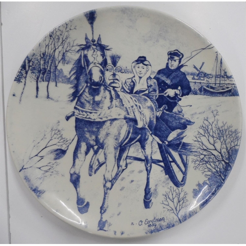 84 - 2 20thC Delft ceramic circular hanging wall plates,

Both measure approx 34 cm in diameter.

one pla... 