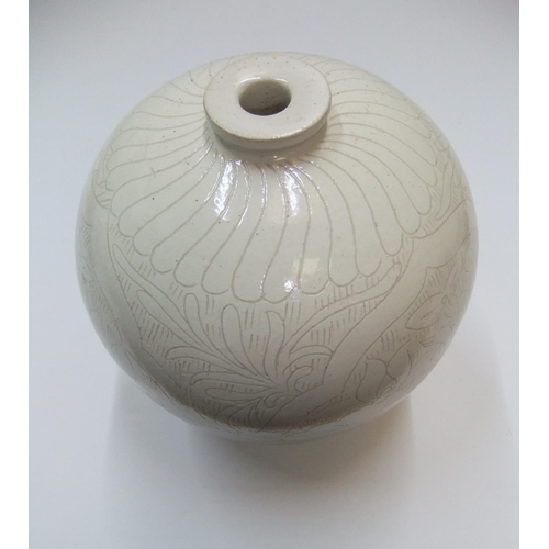 136 - Chinese white glazed narrow necked vase with etched decoration, marked to base

21 cm high