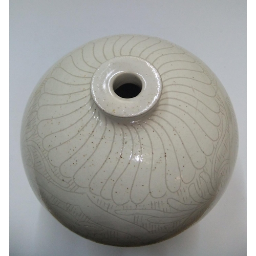 136 - Chinese white glazed narrow necked vase with etched decoration, marked to base

21 cm high