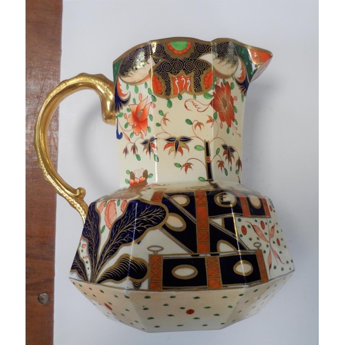 169 - Fine quality, unmarked Victorian water jug decorated extensively in Imari style pattern,

25 cm high