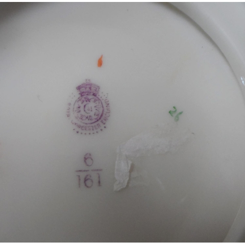 188 - A Royal Worcester cylindrical vase, decorated with a spray of wild flower, raised on a gilt pierced ... 