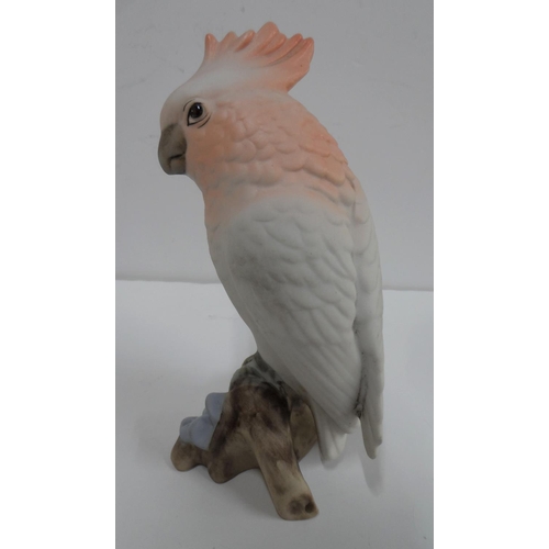 159 - A Royal Dux white porcelain parrot perched on a branch, 20cm high,

Appears in good condition