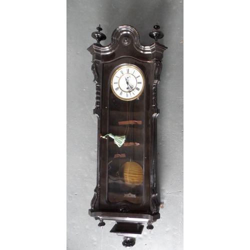 209 - Large antique ebonised ornate wooden wall clock, complete with key, unmarked,

115 cm long,       R1... 