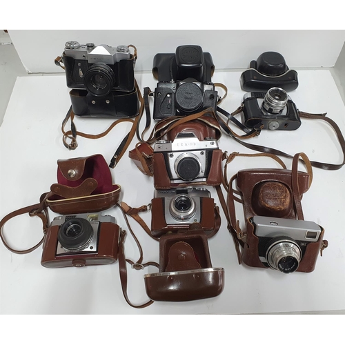 33 - Collection of vintage 20thC cased cameras to include Zeiss & Zenit examples (7)