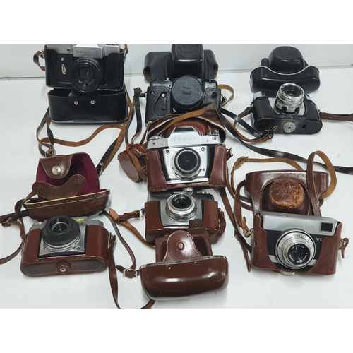 33 - Collection of vintage 20thC cased cameras to include Zeiss & Zenit examples (7)