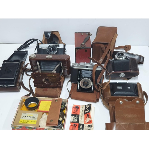 34 - Collection of vintage 20thC cased cameras to include Kershaw & Konica examples together with a small... 