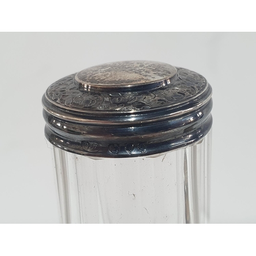 61 - Hallmarked silver power jar together with 3 silver topped jars (4)