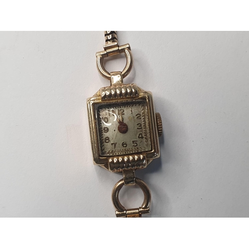 205 - Ladies vintage cocktail watch in 14ct gold case and on a solid 9ct gold strap

12.3 grams gross