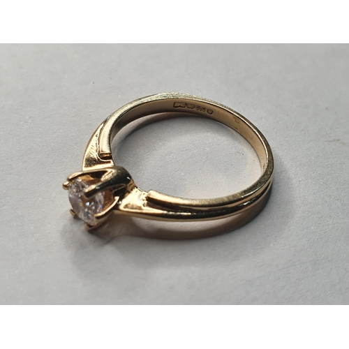 78 - 14ct yellow gold ring with a CZ solitaire stone,

size M       2.6 grams