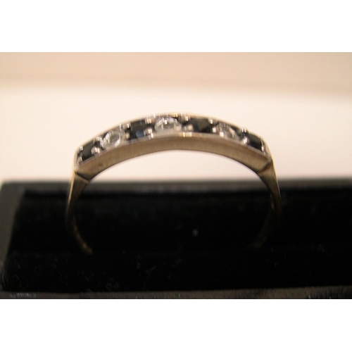 88 - 9ct yellow gold, half eternity ring with alternating diamonds & blue sapphire

Approx 1.3 grams gros... 