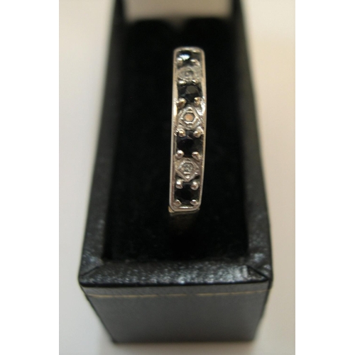 88 - 9ct yellow gold, half eternity ring with alternating diamonds & blue sapphire

Approx 1.3 grams gros... 