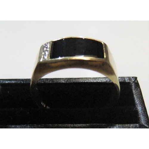 93 - 9ct yellow signet ring with onyx & diamonds

Approx 3.3 grams gross,             size V