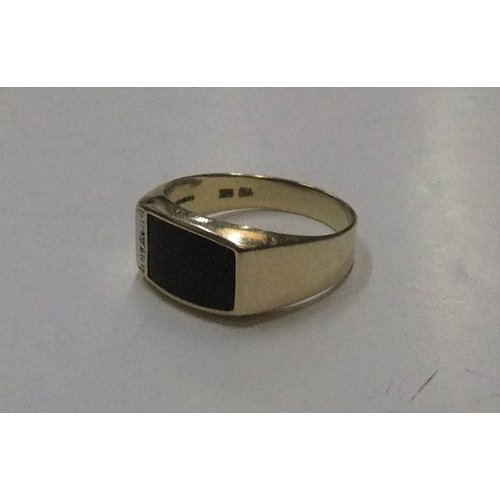 93 - 9ct yellow signet ring with onyx & diamonds

Approx 3.3 grams gross,             size V