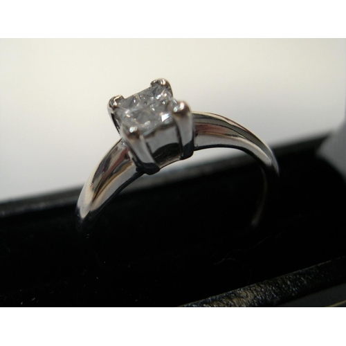 96 - 18ct white gold & diamond ring with 4 princess cut diamonds, rubbed marks.

Approx 2.7 grams gross, ... 