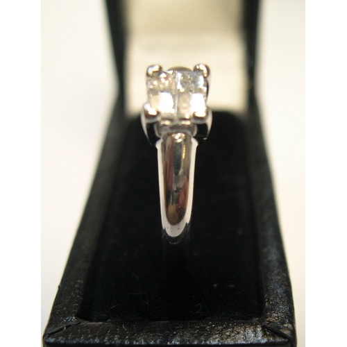 96 - 18ct white gold & diamond ring with 4 princess cut diamonds, rubbed marks.

Approx 2.7 grams gross, ... 