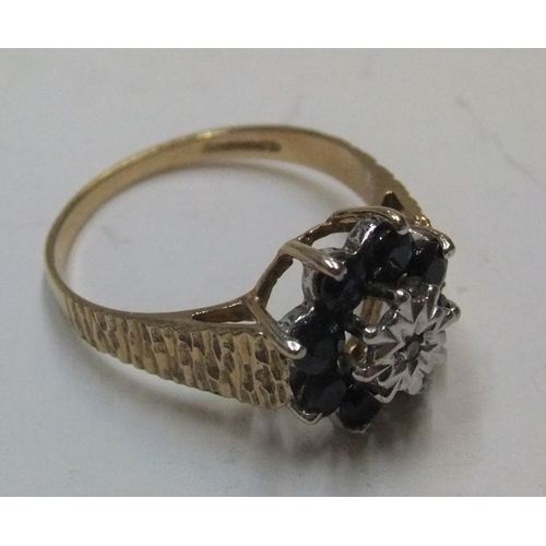 123 - 9ct yellow gold sapphire cluster ring

Approx 2.6 grams gross,           size P