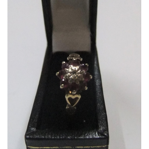 124 - 9ct yellow gold ruby & diamond flower ring

Approx 1.6 grams gross,             size L