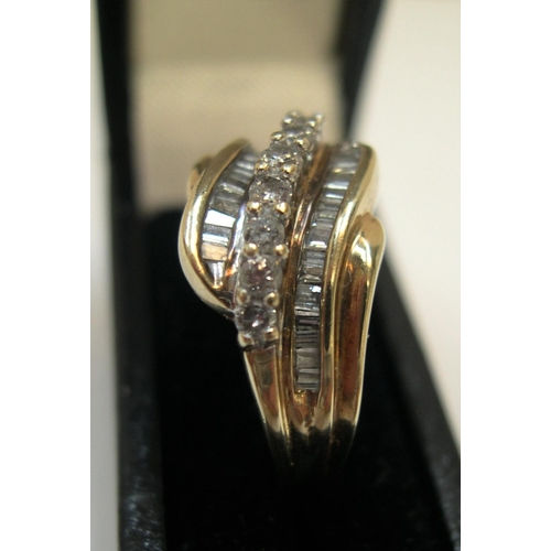 125 - 9ct yellow gold ring set with approx 38 diamonds, total weight approx 0.45ct.

The central row consi... 