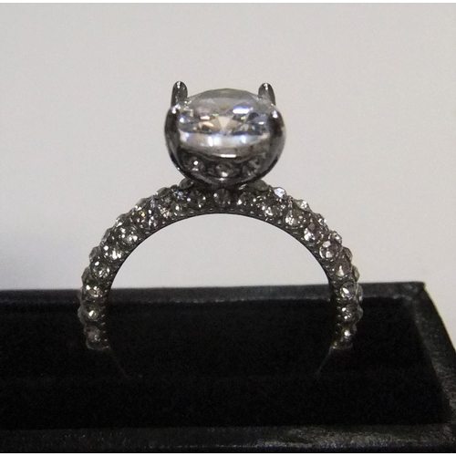 126 - 14ct white gold with large CZ solitaire stone with addional CZ stones addorning the upper part of ea... 