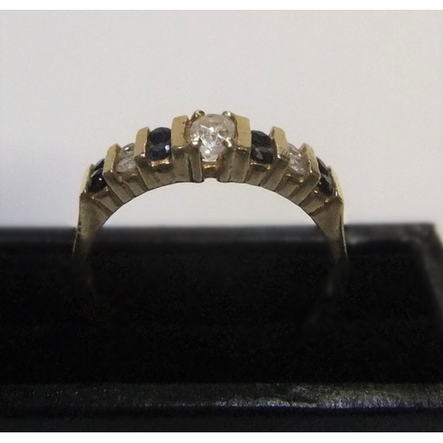 127 - 14ct yellow gold ring set with alternating sapphire & diamonds

approx 3.1 grams gross,           si... 