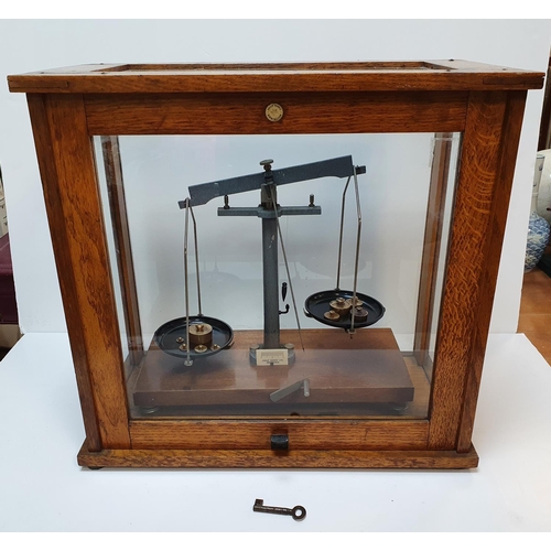 54 - Cased set of balance scales (complete) by Phillip Harrison of Birmingham,

46 cm long,

Small crack ... 