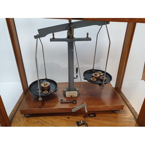 54 - Cased set of balance scales (complete) by Phillip Harrison of Birmingham,

46 cm long,

Small crack ... 