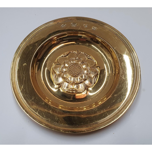 66 - Hallmarked silver gilt, 1963 circular dish embossed with an English rose by Hickleton & Phillips

14... 