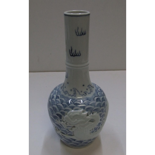 149 - Chinese 20thC single stem, unusual light B&W vase with white dragon decoration, stamped mark to base... 