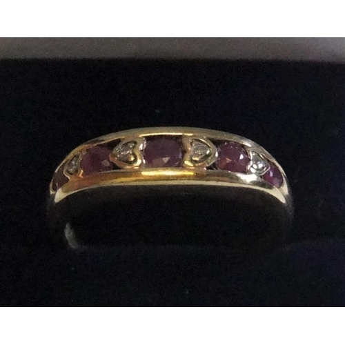 437 - 9ct yellow gold ring with round cut rubies interspersed with diamonds 

approx 2.3 grams gross,     ... 