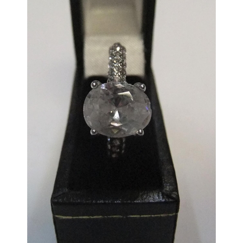 440 - 14ct white gold with large CZ solitaire stone with addional CZ stones addorning the upper part of ea... 