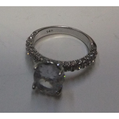 440 - 14ct white gold with large CZ solitaire stone with addional CZ stones addorning the upper part of ea... 