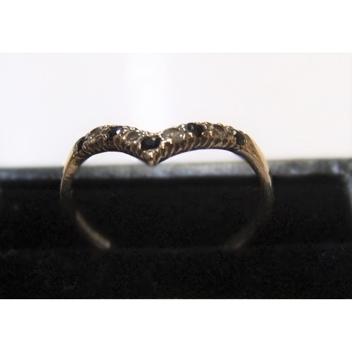 445 - 9ct yellow gold wishbone ring with white & blue stone ring

Approx 1.2 grams gross,             size... 