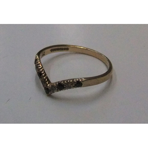 445 - 9ct yellow gold wishbone ring with white & blue stone ring

Approx 1.2 grams gross,             size... 