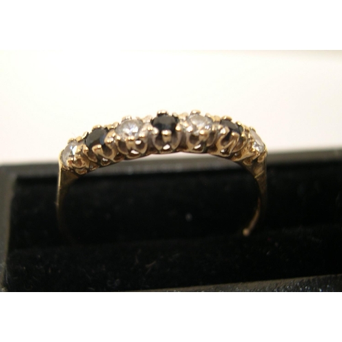 450 - 9ct yellow gold, half eternity ring with sapphire & clear stone ring

Approx 1.1 grams gross,       ... 
