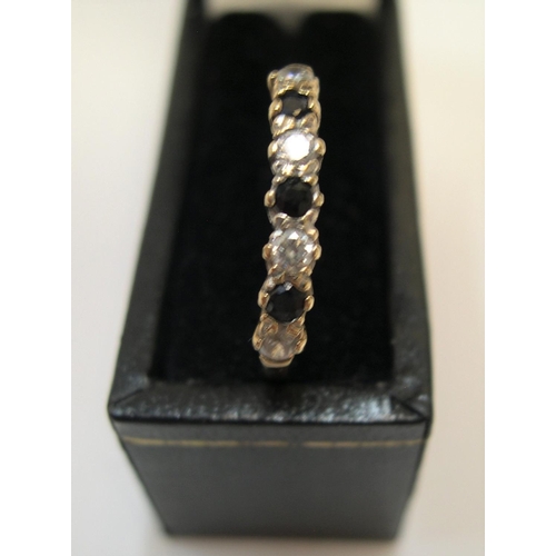 450 - 9ct yellow gold, half eternity ring with sapphire & clear stone ring

Approx 1.1 grams gross,       ... 