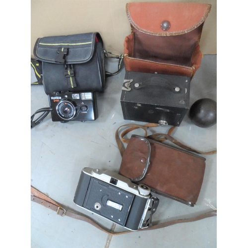 39 - Three old cased cameras together with a signed cricket bat & old ball (lot)