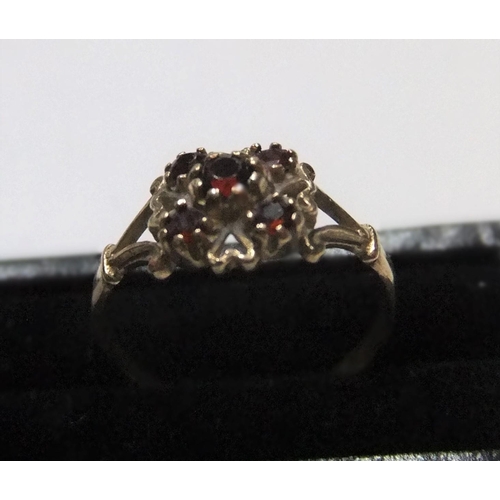 28 - 9ct yellow gold, 5 garnet ring

Approx 1.5 grams gross,           size N/O